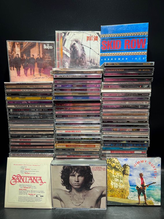 Over 50 Compact Discs Featuring Various Artists and Genres