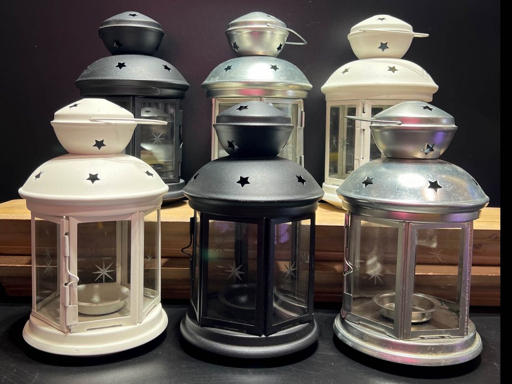 Six Decorative Metal Lanterns in Black, White, and Silver