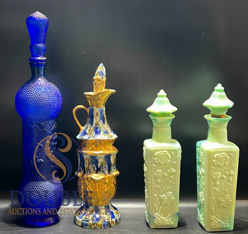 Four Decorative Glass Bottles Including Cobalt Blue, Ceramic, and Milk Glass