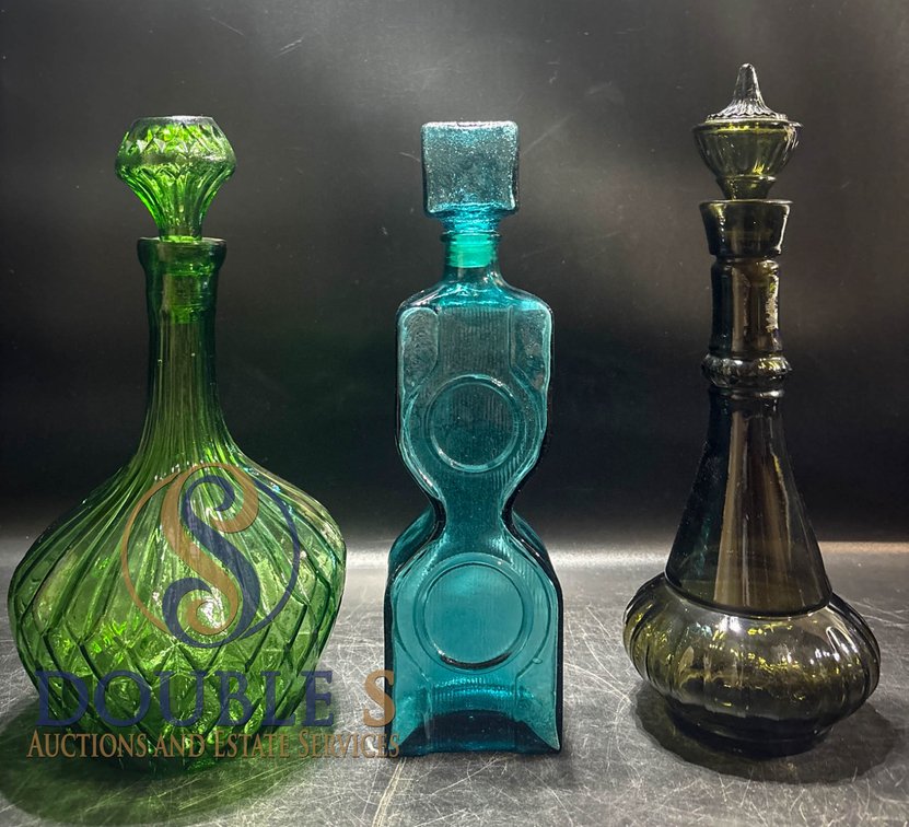 Three Glass Decanters With Stoppers in Green, Blue, and Amber