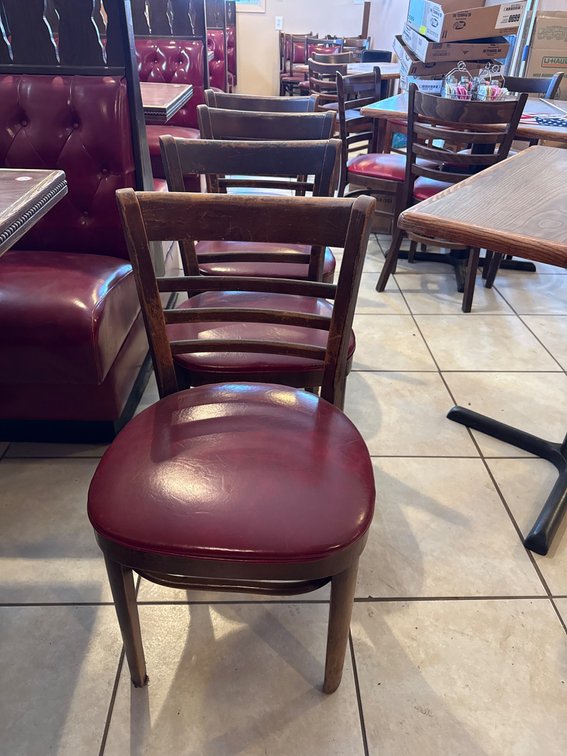 Four Wooden Slat-Back Chairs with Red Vinyl Seats