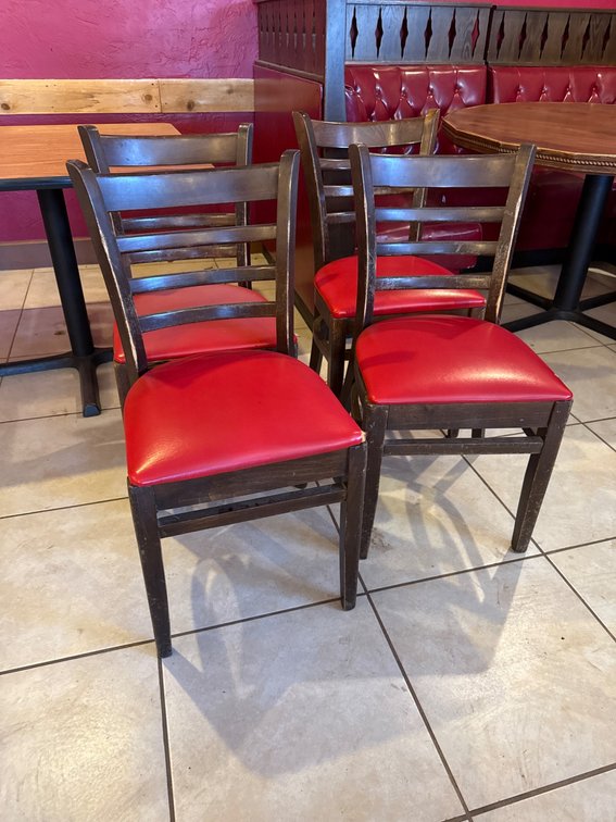 Four Wooden Chairs With Red Vinyl Upholstered Seats
