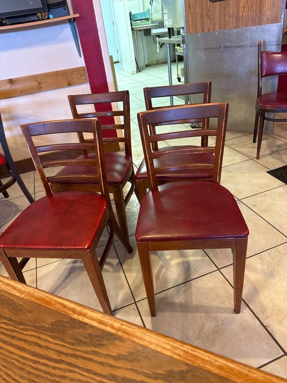 Four Wooden Chairs with Ladder Backs and Red Vinyl Seats