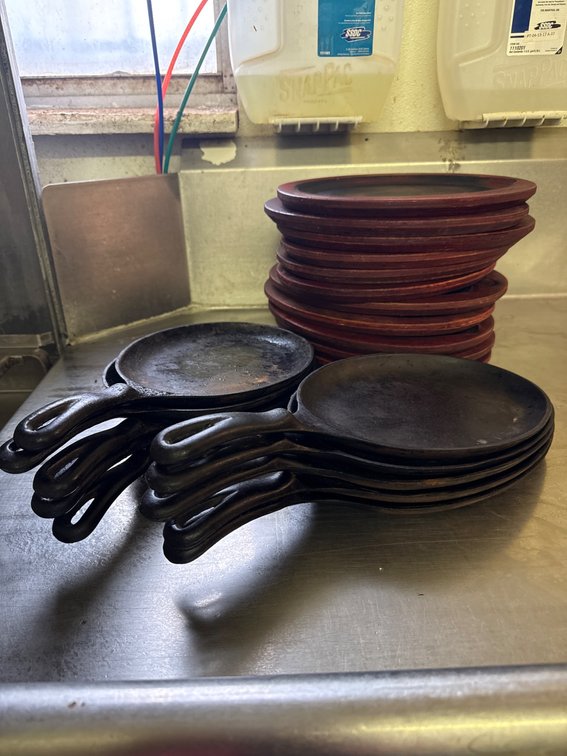 10 Cast Iron Sizzling Plates and Wooden Trivets by Lodge