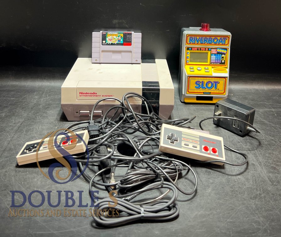 Nintendo NES Console with Super Mario All-Stars Cartridge, Controllers, and Riverboat Slot Machine Bank