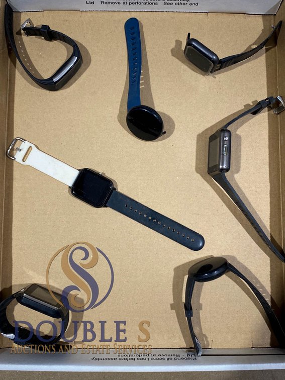 Seven Assorted Smart Watches in Various Styles and Sizes