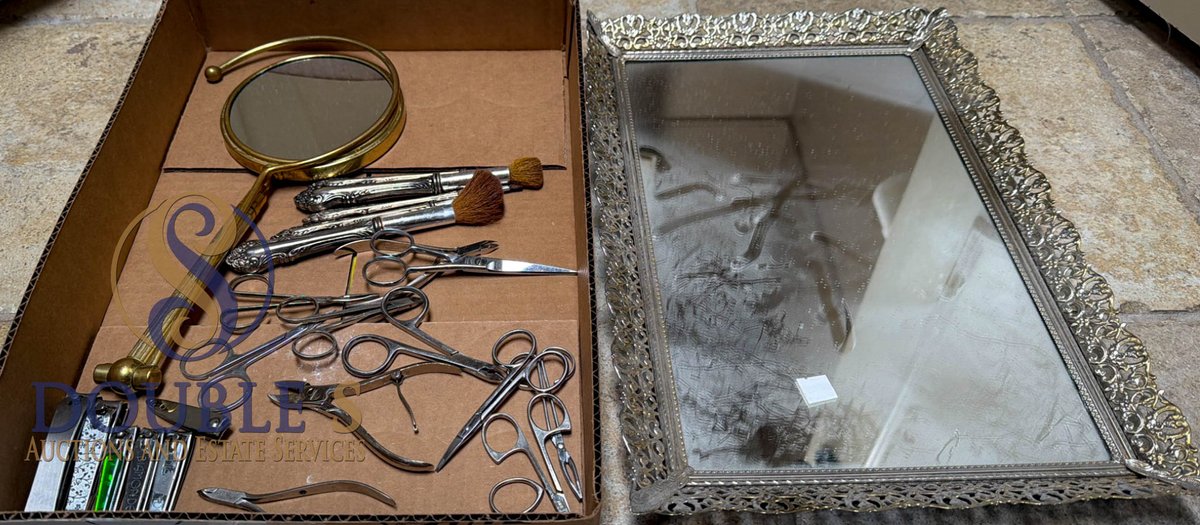 Vanity Items Including Magnifying Mirror, Metal Tools, and Ornate Rectangular Mirror