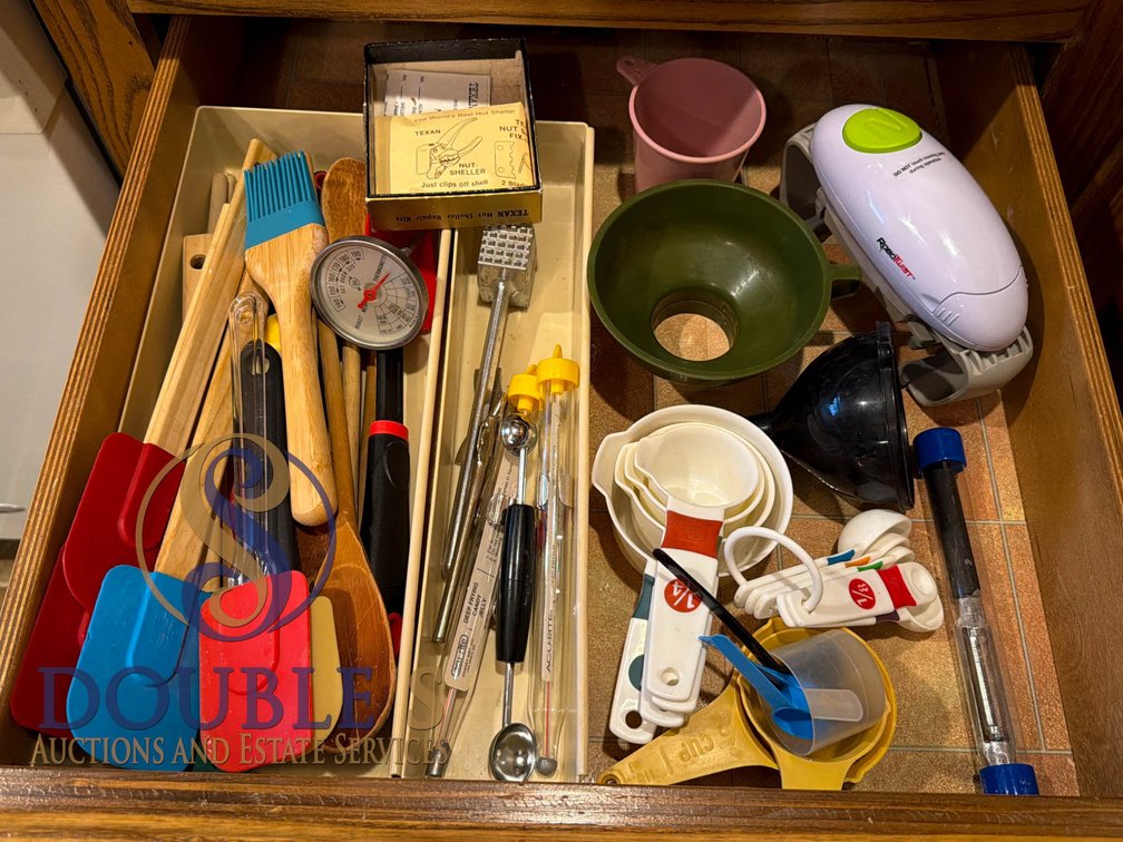 Kitchen Tools and Utensils Including Measuring Cups, Thermometer, and RoboTwist Opener