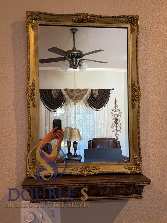Wall-Mounted Mirror with Ornate Gilded Frame and Decorative Wood Shelf