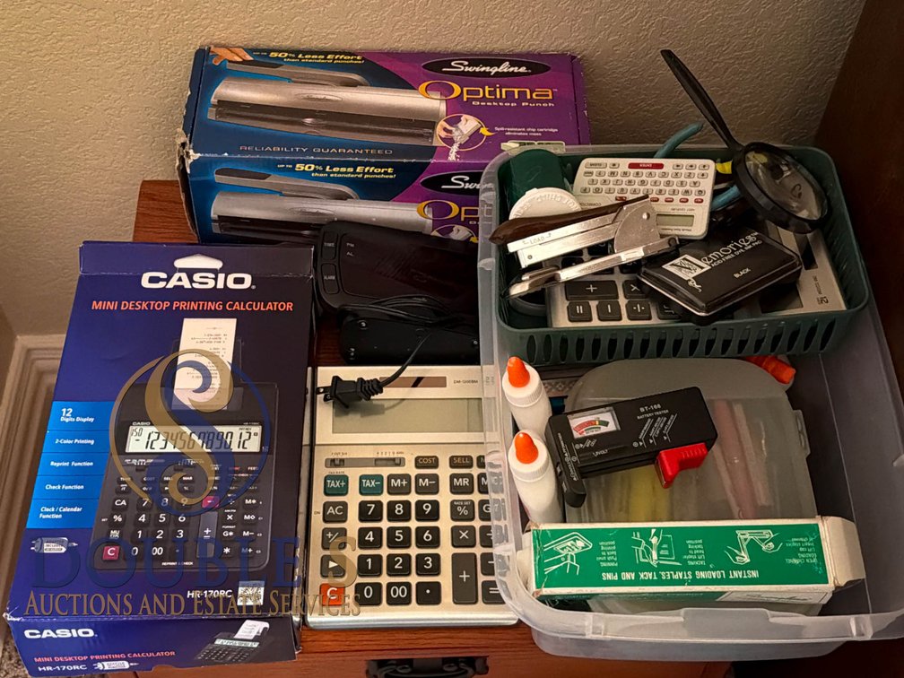 Office Supplies Including Calculators, Hole Punch, and Stationery Items