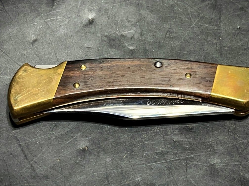 Buck 110 Folding Knife With Engraved Blade