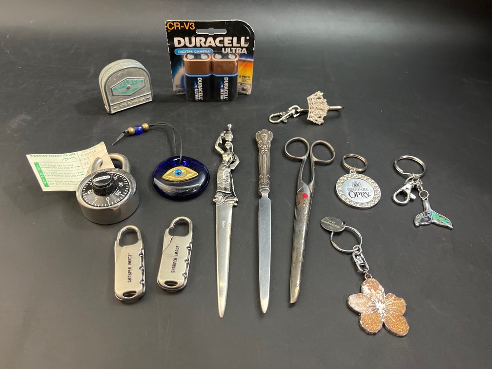 Locks, letter openers, key chains, batteries, measuring tape, etc