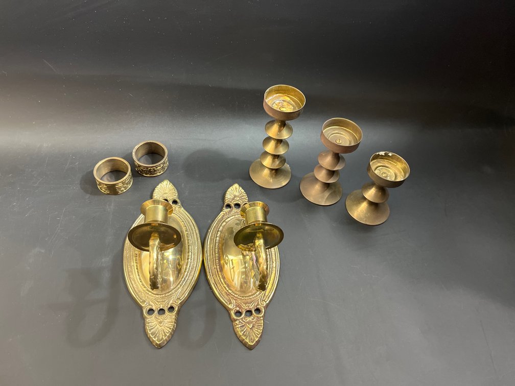 Solid brass candlestick holders, pair brass wall sconces, & brass napkin rings 