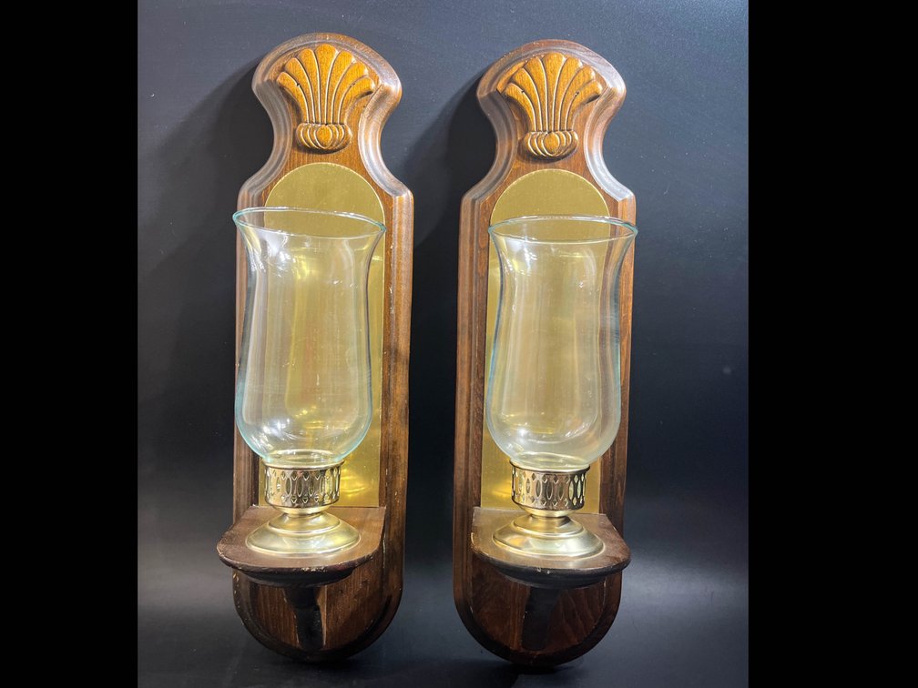 Two wooden wall sconces with gold tone accents 