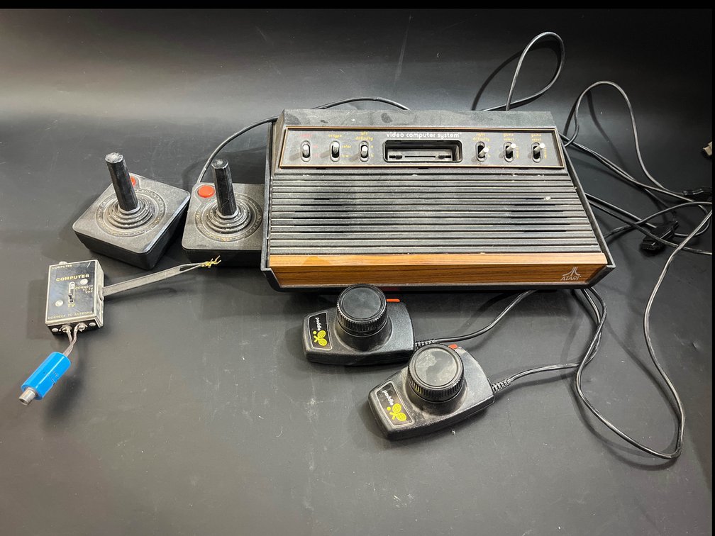 Vintage Atari 2600 system, joy sticks, & paddles