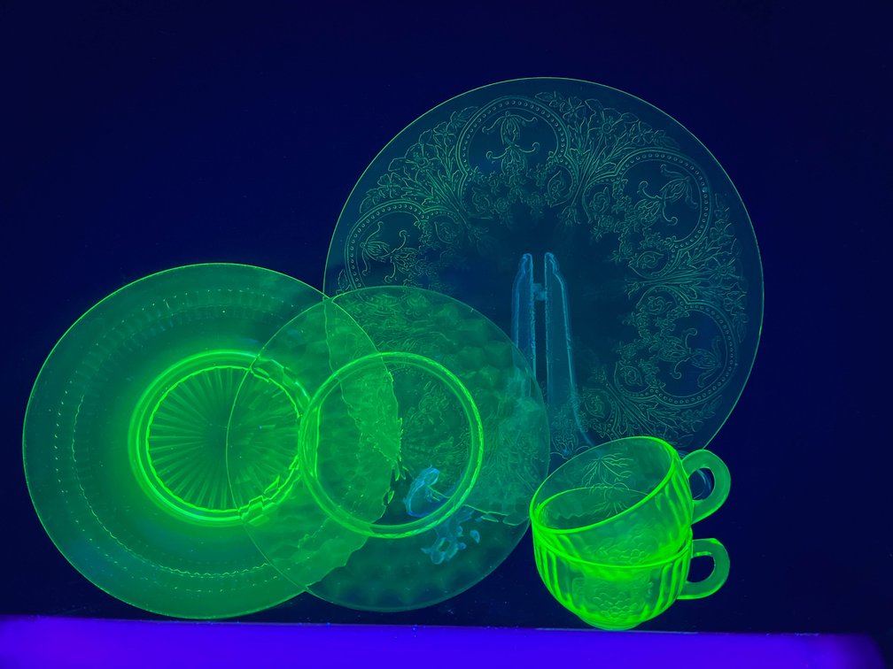 Uranium glass, 8 plates, and 3 teacups