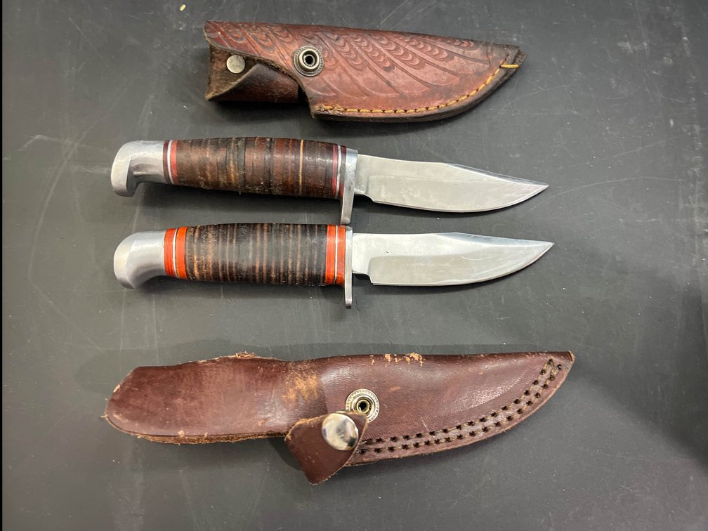 Two 4” blade knives with leather sheaths