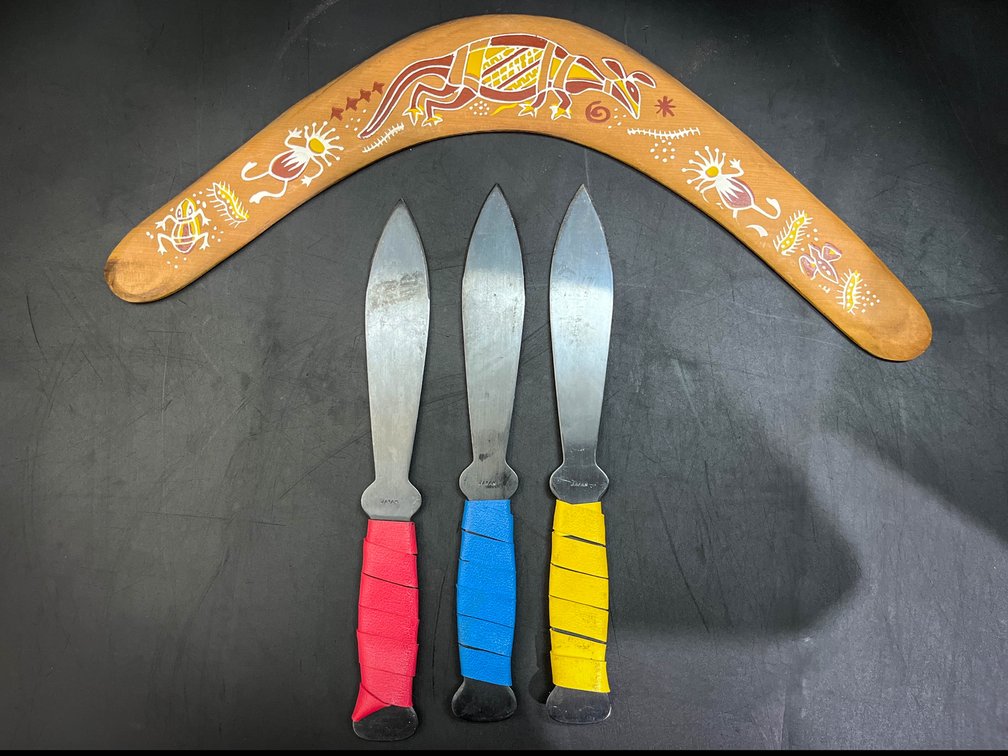 Boomerang and three 5” blade throwing knives 