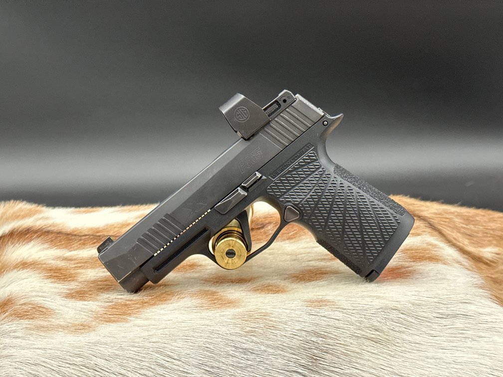  Sig Sauer P365 9 mm with Sig red dot sight and Wilson Compact grip, straight trigger