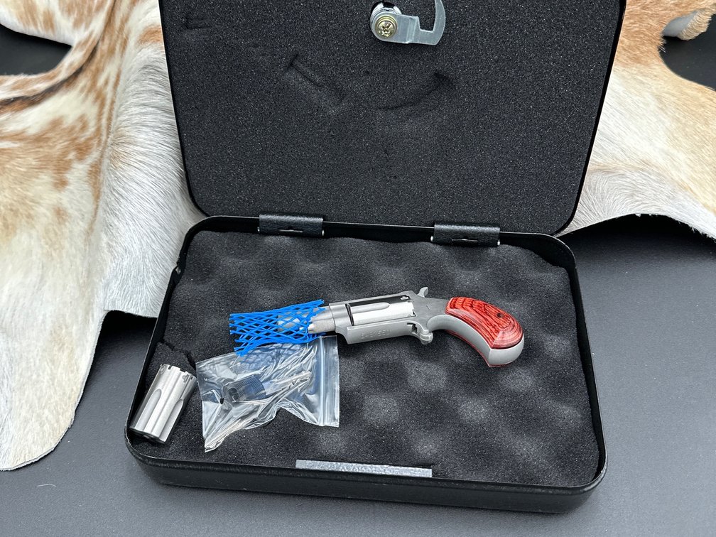 North American Arms .22 Mag 1 5/8 Barrel, has lock box with keys and outer box, has conversion cylinder Model M, wooden grips