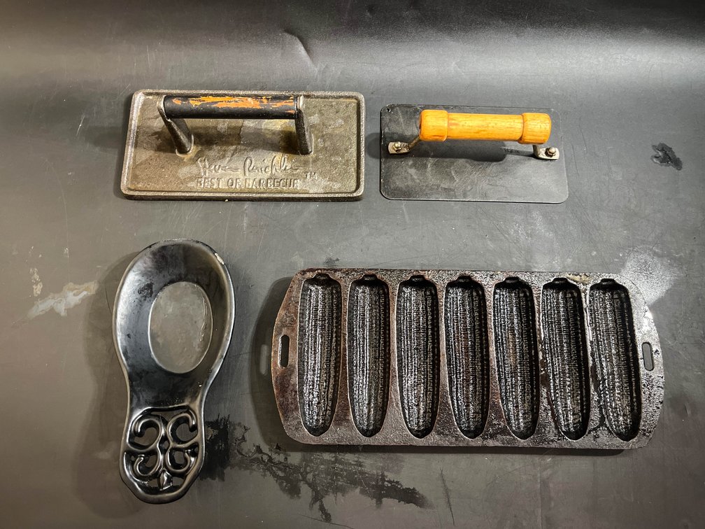Cast iron corn bread pan, cast iron grill press, bacon press, and spoon rest