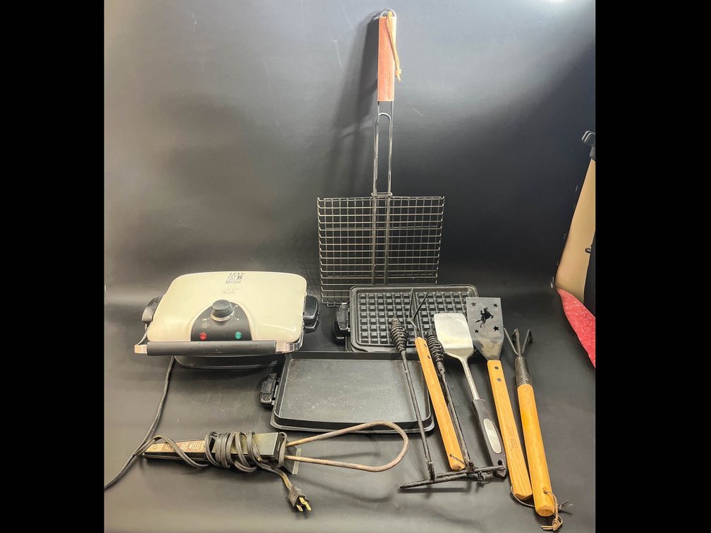 George Foreman grill with inserts, grilling utensils, electric charcoal starter, and grill basket