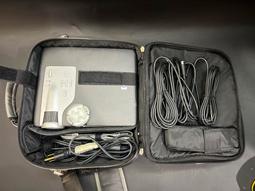 HP projector in storage bag with cords