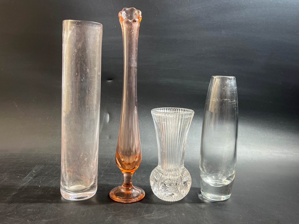 Four glass bud vases