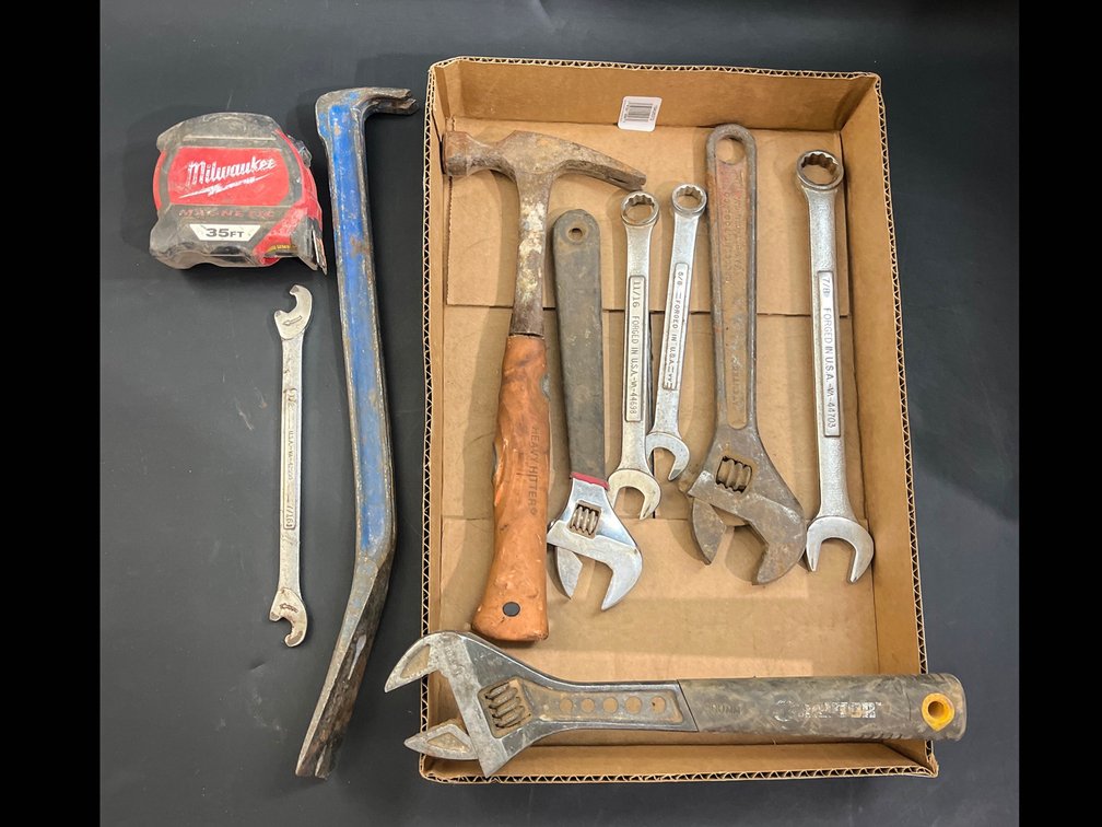 Hammer, wrenches, combination wrenches, crow bar, measuring tape, etc 