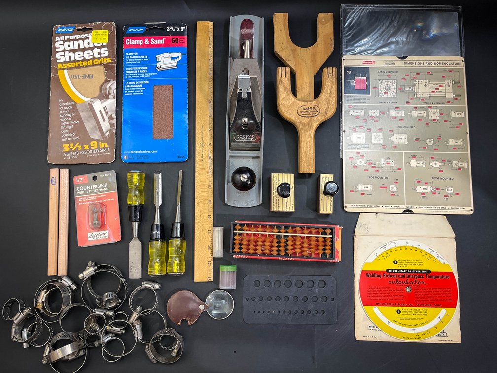 Sander, sandpaper, calculators, stamps, etc 