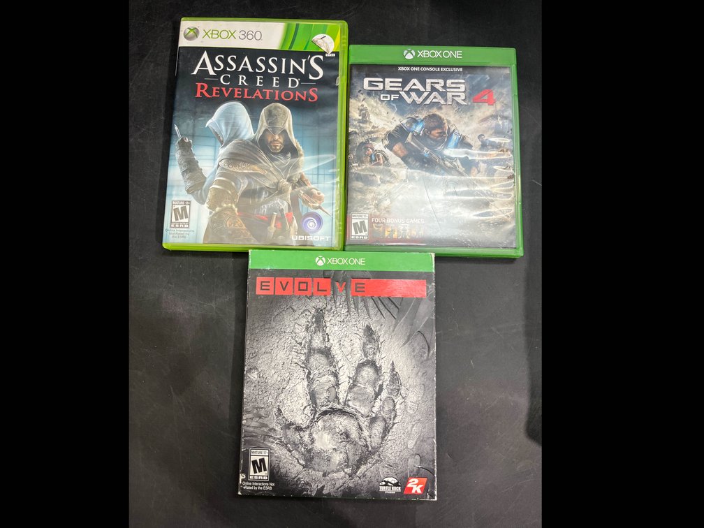 Xbox One games, Evolve, Gears of War 4, and Xbox 360 game Assassins Creed Revelations