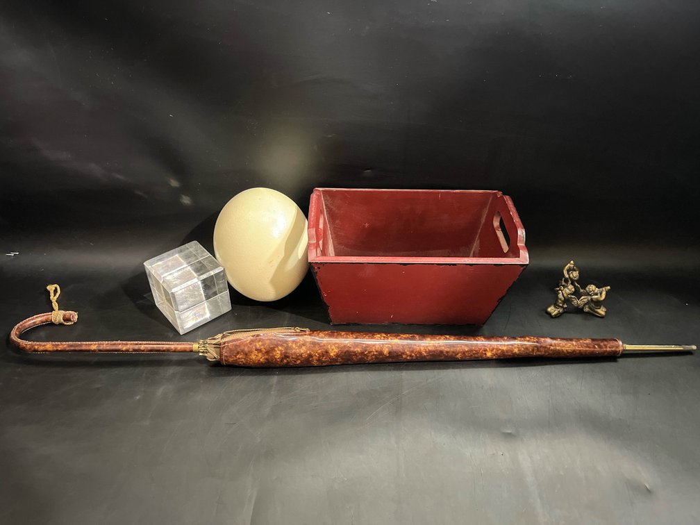 33” vintage parasol, ostrich egg, cherub metal stand, paperweight, and small basket