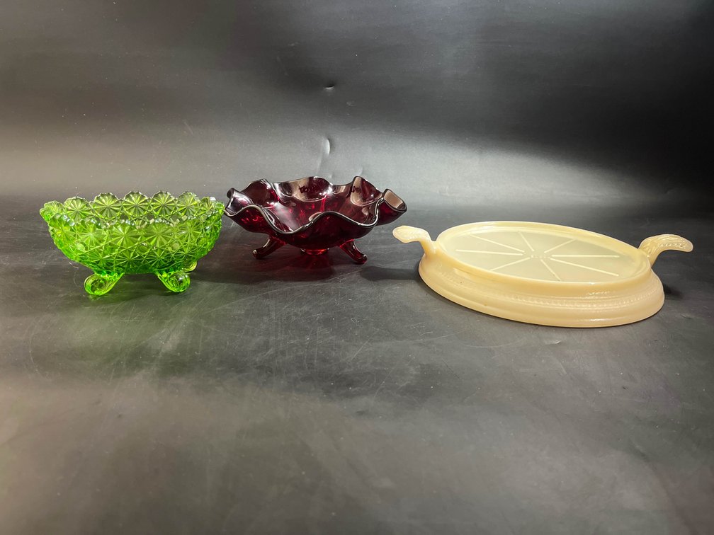 Vintage daisy and button oval dish, red glass candy dish, and vintage Fire King Glass Oven Trivet