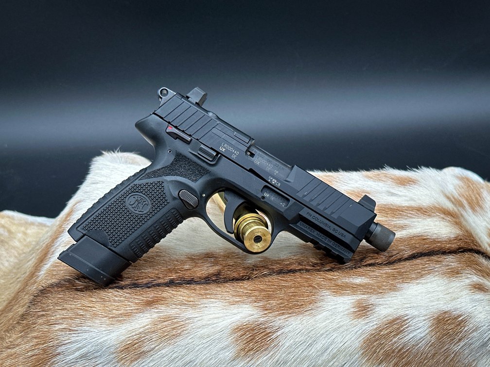 FN 502 pistol, 22 LR, 2 mags, in orginal box, paperwork with different plates included