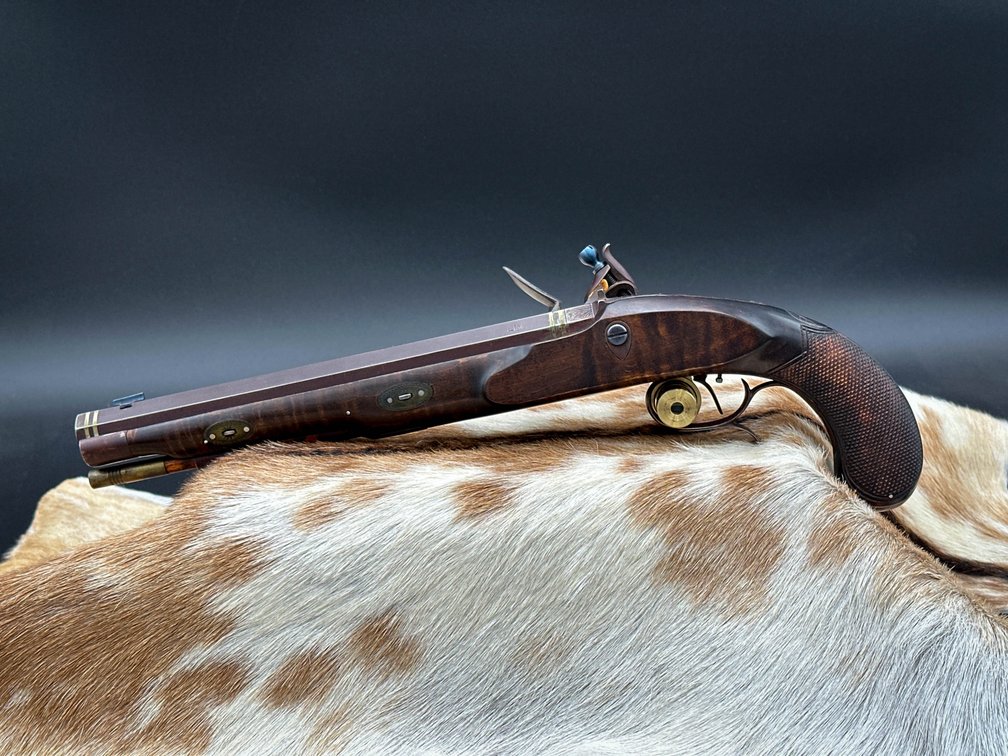 Black powder flint pistol with octogon barrel, has JF Bergmann on barrel