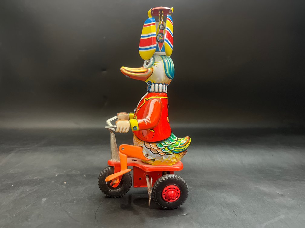 Vintage Schylling Duck-on-Bike toy
