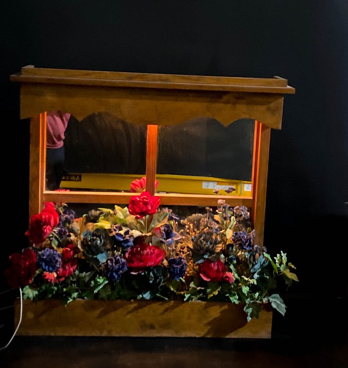 Wooden Window Display With Artificial Flowers