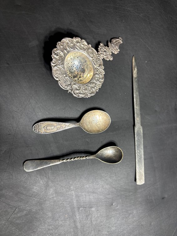 Collection of Silver-Toned  Tea Accessories Including Strainer, Spoons, and Stirrer
