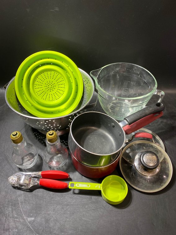 Assorted Kitchenware Including Pots and Measuring Tools