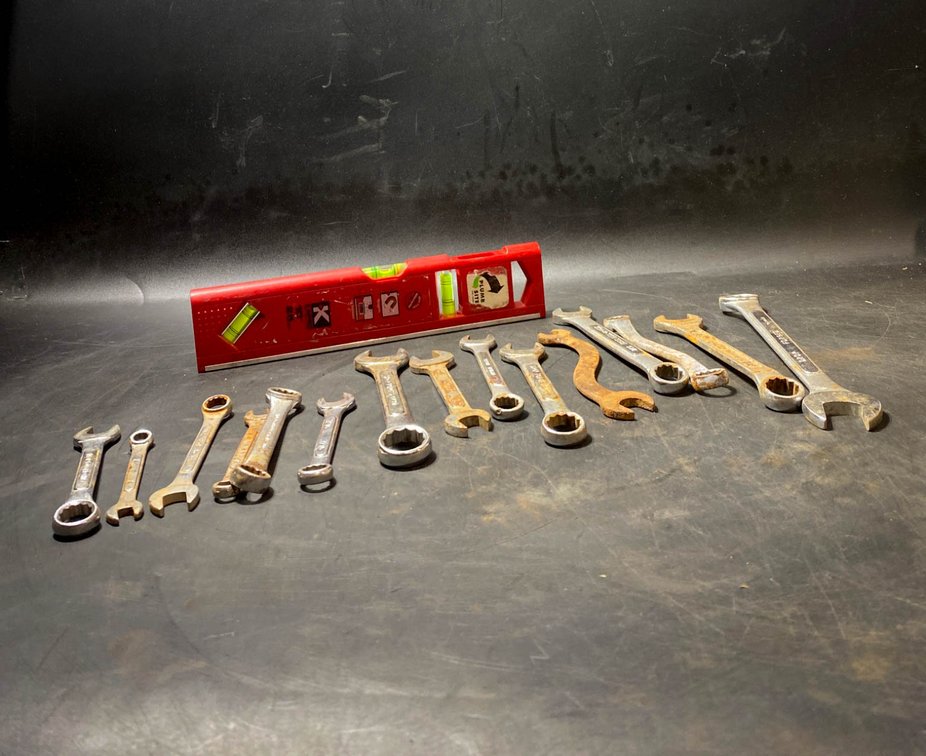 Set of Mixed Wrenches and Red Level Tool