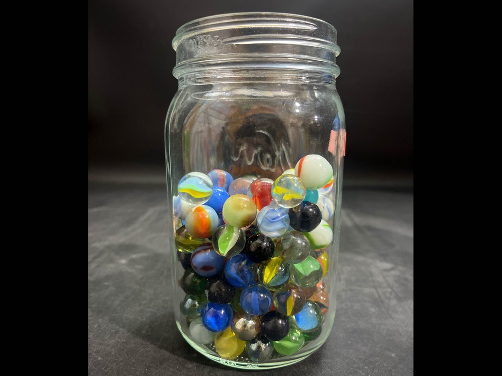 6.5” glass jar of Marbles