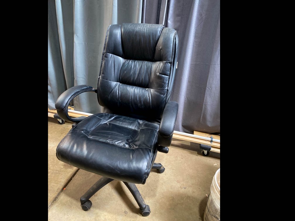 Black office chair on wheels 27 1/2” x 44” 