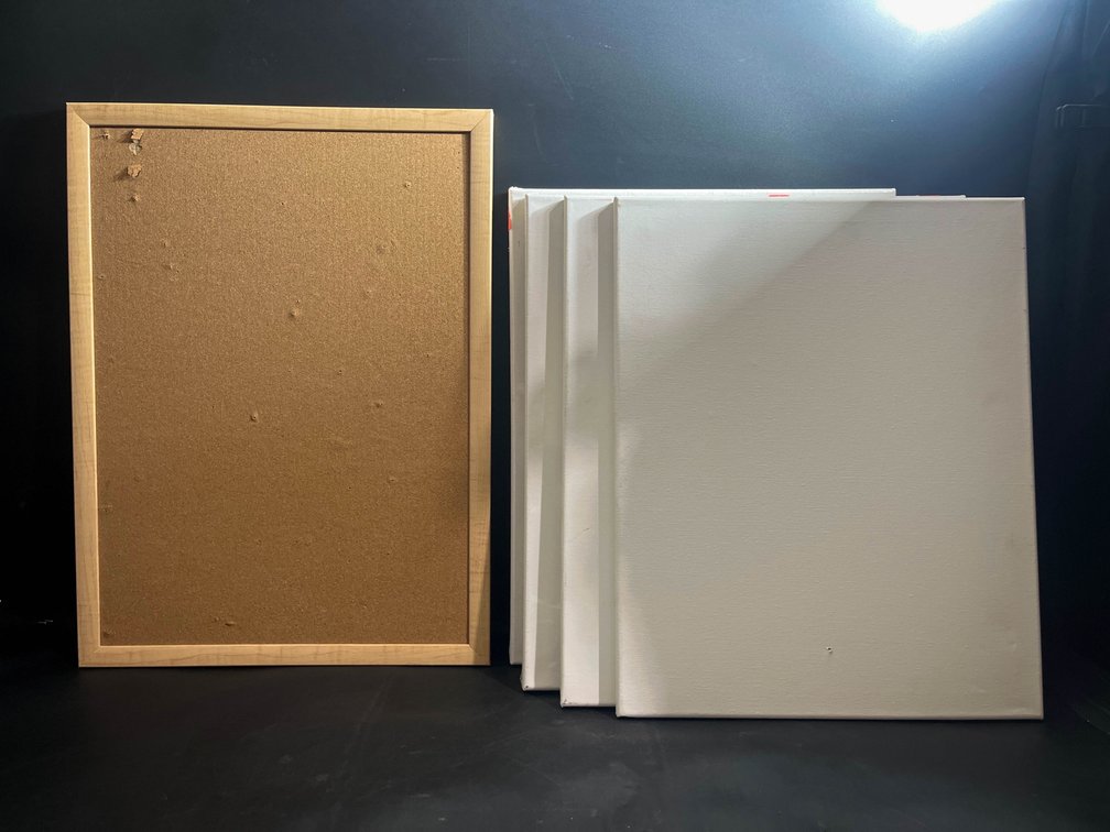 Four 16”x20” blank canvases, and 23”x17” cork board 