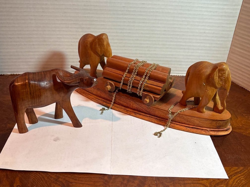 Hand-Carved Wooden Animal Figures and Ox Cart Display