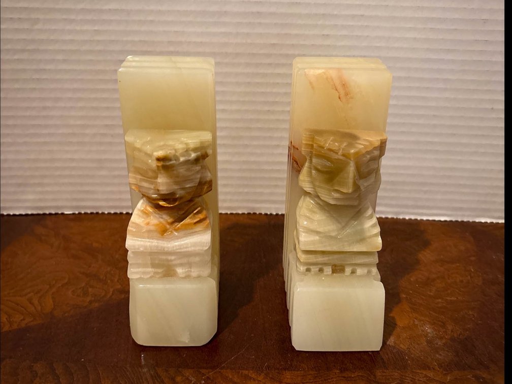 Two Onyx Carved Bookends Featuring Faces