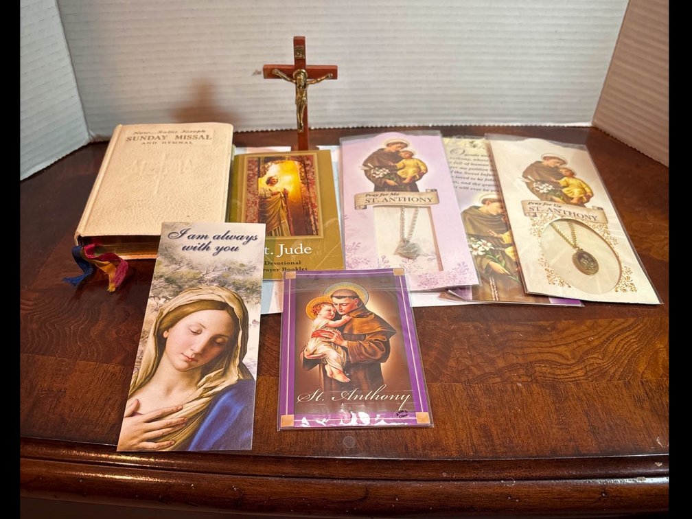 Catholic Religious Items Including Sunday Missal, Bookmarks, and Crucifix