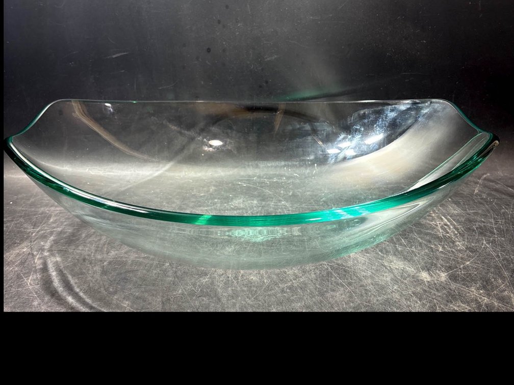 Clear Glass Oval Bowl With a Curved Rim Design