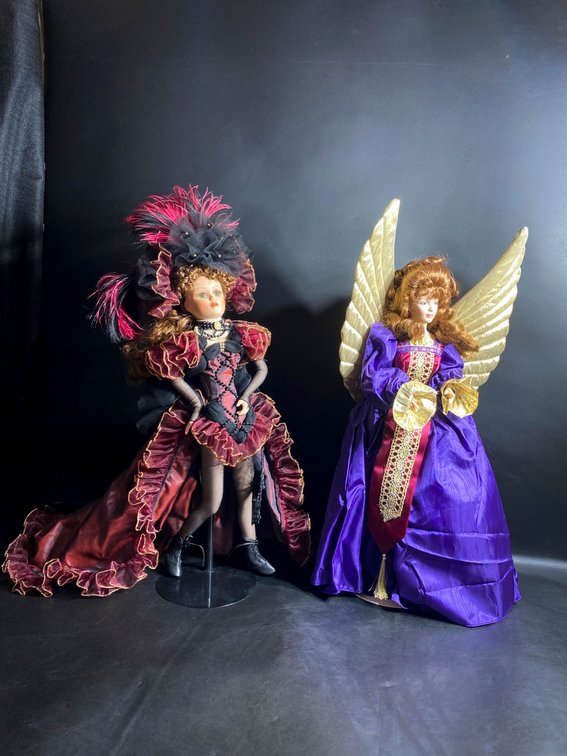 Collectible Porcelain Dolls in Themed Attire with Boxes