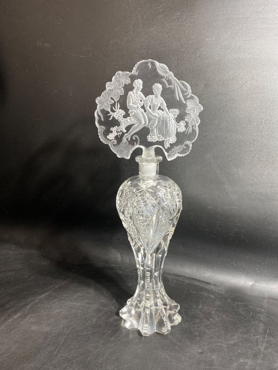 Cut Glass Perfume Bottle with Decorative Stopper Featuring Romantic Scene