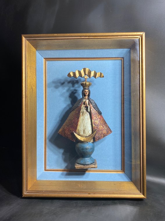 Framed Polychrome Madonna Figurine on Blue Background